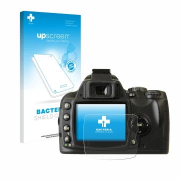 Parte frontal de un envase de producto con el logotipo de la marca upscreen. Al lado se muestra el dispositivo Nikon D40x con 