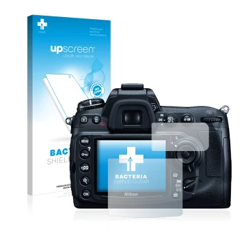 Parte frontal de un envase de producto con el logotipo de la marca upscreen. Al lado se muestra el dispositivo Nikon D300 con 