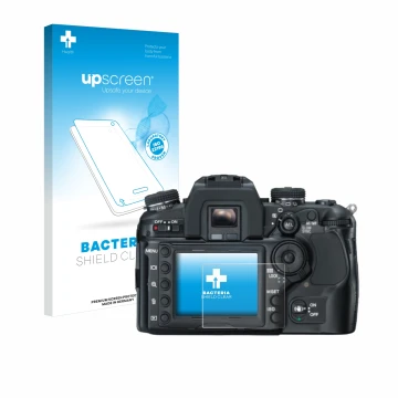 Parte frontal de un envase de producto con el logotipo de la marca upscreen. Al lado se muestra el dispositivo Konica Minolta 