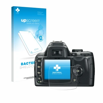Parte frontal de un envase de producto con el logotipo de la marca upscreen. Al lado se muestra el dispositivo Nikon D60 con s