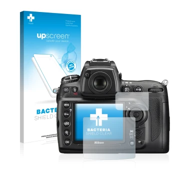 Parte frontal de un envase de producto con el logotipo de la marca upscreen. Al lado se muestra el dispositivo Nikon D700 con 