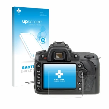 Parte frontal de un envase de producto con el logotipo de la marca upscreen. Al lado se muestra el dispositivo Nikon D90 con s