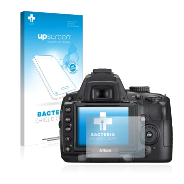 Parte frontal de un envase de producto con el logotipo de la marca upscreen. Al lado se muestra el dispositivo Nikon D5000 con