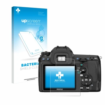 Parte frontal de un envase de producto con el logotipo de la marca upscreen. Al lado se muestra el dispositivo Pentax K5, K-5 