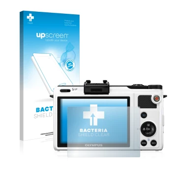 Parte frontal de un envase de producto con el logotipo de la marca upscreen. Al lado se muestra el dispositivo Olympus XZ-1 co