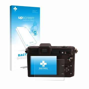 Parte frontal de un envase de producto con el logotipo de la marca upscreen. Al lado se muestra el dispositivo Nikon 1 V1 con 