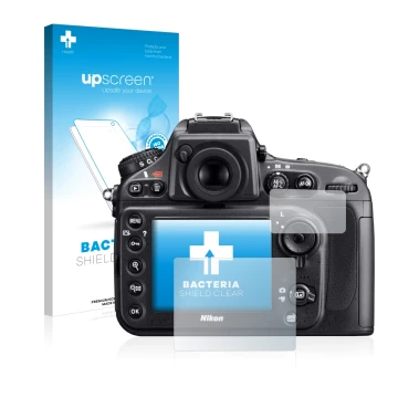 Parte frontal de un envase de producto con el logotipo de la marca upscreen. Al lado se muestra el dispositivo Nikon D800 con 