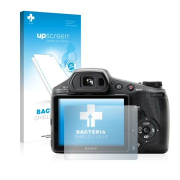 Parte frontal de un envase de producto con el logotipo de la marca upscreen. Al lado se muestra el dispositivo Sony Cyber-Shot
