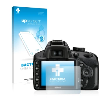 Parte frontal de un envase de producto con el logotipo de la marca upscreen. Al lado se muestra el dispositivo Nikon D3200 con