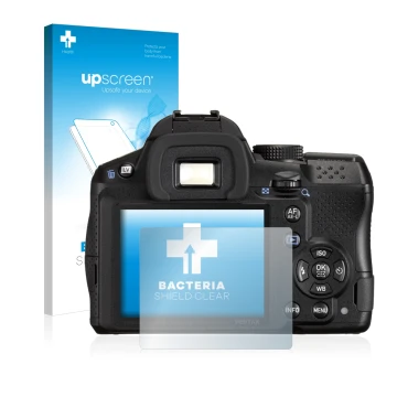 Parte frontal de un envase de producto con el logotipo de la marca upscreen. Al lado se muestra el dispositivo Pentax K-30 con
