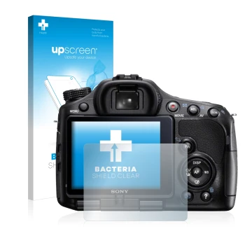 Parte frontal de un envase de producto con el logotipo de la marca upscreen. Al lado se muestra el dispositivo Sony Alpha 57 (