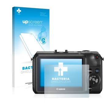 Parte frontal de un envase de producto con el logotipo de la marca upscreen. Al lado se muestra el dispositivo Canon EOS M con