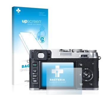 Parte frontal de un envase de producto con el logotipo de la marca upscreen. Al lado se muestra el dispositivo Fujifilm X100S 
