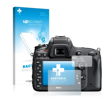 Parte frontal de un envase de producto con el logotipo de la marca upscreen. Al lado se muestra el dispositivo Nikon D610 con 