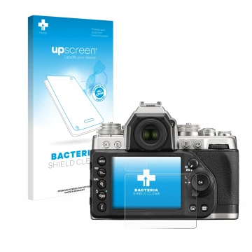 Parte frontal de un envase de producto con el logotipo de la marca upscreen. Al lado se muestra el dispositivo Nikon Df con su