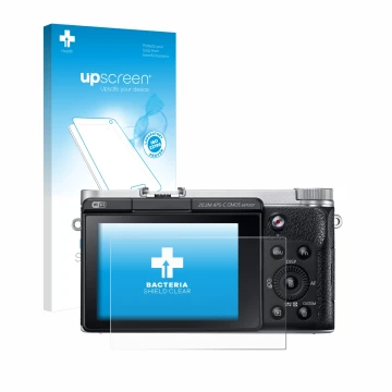 Parte frontal de un envase de producto con el logotipo de la marca upscreen. Al lado se muestra el dispositivo Samsung NX300M 