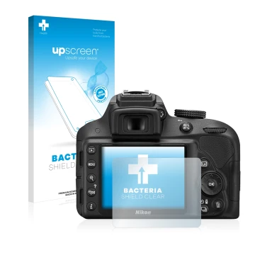 Parte frontal de un envase de producto con el logotipo de la marca upscreen. Al lado se muestra el dispositivo Nikon D3300 con