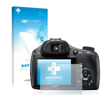 Parte frontal de un envase de producto con el logotipo de la marca upscreen. Al lado se muestra el dispositivo Sony Cyber-Shot