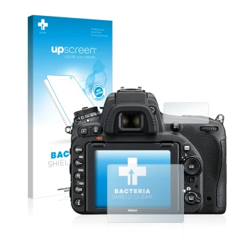 Parte frontal de un envase de producto con el logotipo de la marca upscreen. Al lado se muestra el dispositivo Nikon D750 con 