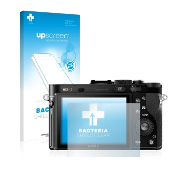 Parte frontal de un envase de producto con el logotipo de la marca upscreen. Al lado se muestra el dispositivo Sony Cyber-Shot