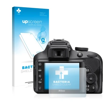 Parte frontal de un envase de producto con el logotipo de la marca upscreen. Al lado se muestra el dispositivo Nikon D3400 con