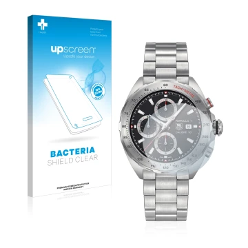 Parte frontal de un envase de producto con el logotipo de la marca upscreen. Al lado se muestra el dispositivo TAG Heuer Formu