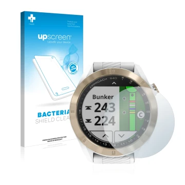 Parte frontal de un envase de producto con el logotipo de la marca upscreen. Al lado se muestra el dispositivo Garmin Approach