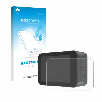 Parte frontal de un envase de producto con el logotipo de la marca upscreen. Al lado se muestra el dispositivo Akaso V50X con 