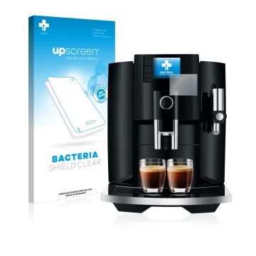 Parte frontal de un envase de producto con el logotipo de la marca upscreen. Al lado se muestra el dispositivo Jura E8 (EB) co