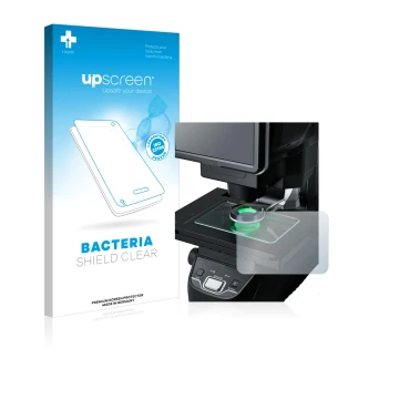 Parte frontal de un envase de producto con el logotipo de la marca upscreen. Al lado se muestra el dispositivo Keyence IM-7030