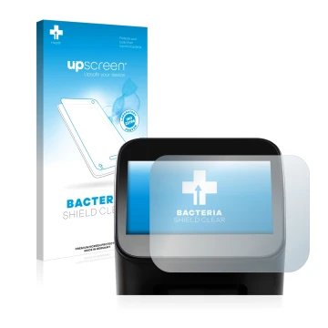 Parte frontal de un envase de producto con el logotipo de la marca upscreen. Al lado se muestra el dispositivo Shaper Origin G