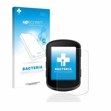 Parte frontal de un envase de producto con el logotipo de la marca upscreen. Al lado se muestra el dispositivo Garmin Edge 540