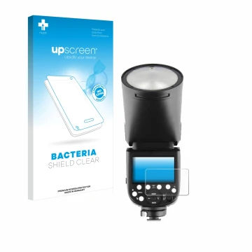 Parte frontal de un envase de producto con el logotipo de la marca upscreen. Al lado se muestra el dispositivo Godox V1 con su