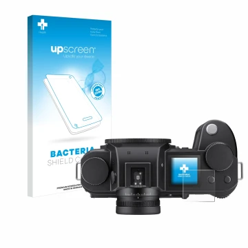 Parte frontal de un envase de producto con el logotipo de la marca upscreen. Al lado se muestra el dispositivo Leica SL3 (pant