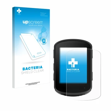 Parte frontal de un envase de producto con el logotipo de la marca upscreen. Al lado se muestra el dispositivo Garmin Edge 840