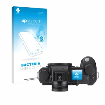 Parte frontal de un envase de producto con el logotipo de la marca upscreen. Al lado se muestra el dispositivo Leica SL3-S (pa