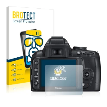 Parte frontal de un envase de producto con el logotipo de la marca BROTECT. Al lado se muestra el dispositivo Nikon D3000 con 