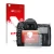 Parte frontal de un envase de producto con el logotipo de la marca upscreen. Al lado se muestra el dispositivo Nikon D7000 con